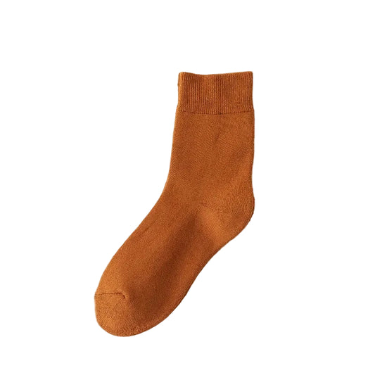 Brown sock on a beige background