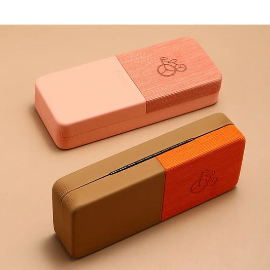 Two wooden blocks, one pink and one brown, on a beige background.