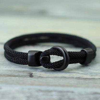 A red and black bracelet with a dual-layer design and a black clasp.